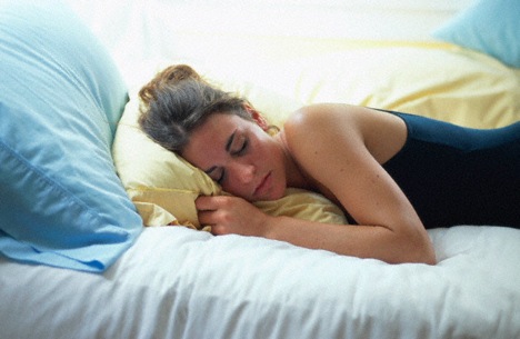 woman-sleeping-on-pillows