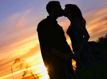 Silhouette Of A Couple Kissing