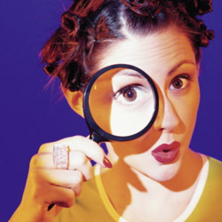 woman-looking-through-magnifying-glass
